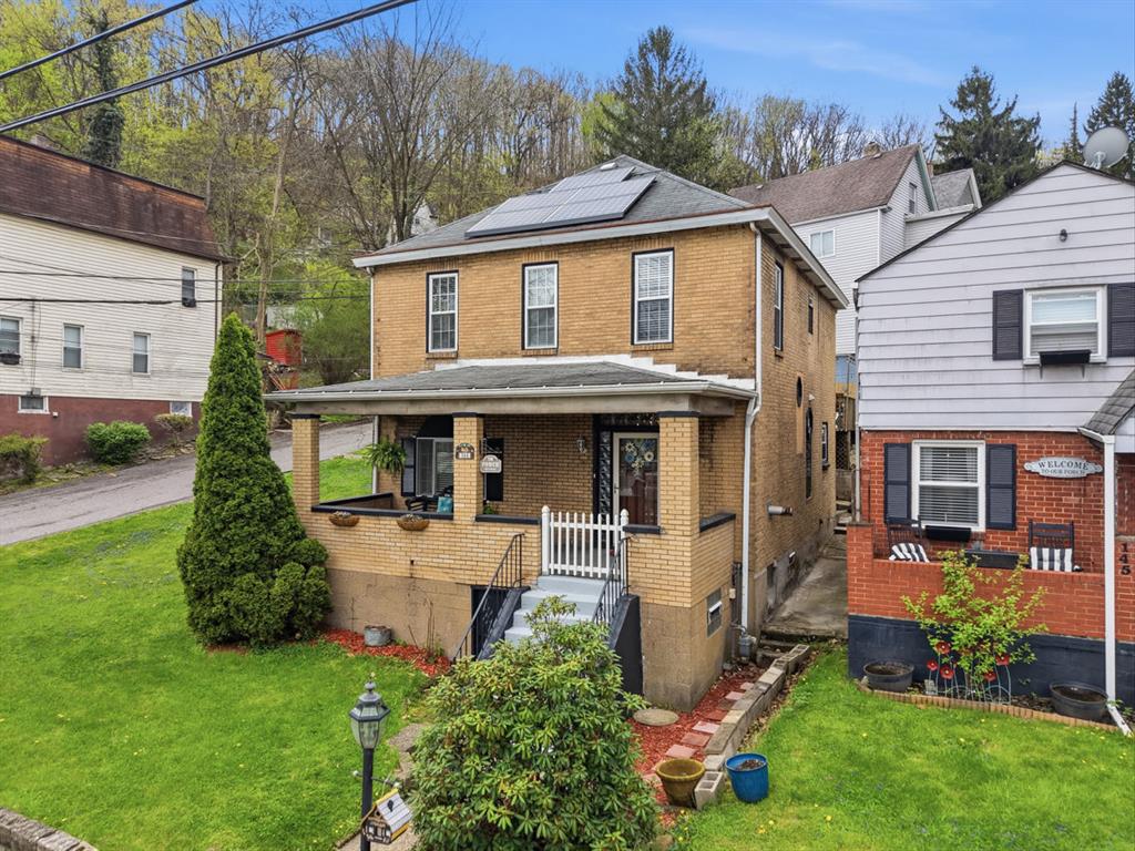 144 Davis Avenue McKees Rocks, PA 15136 - Photo 2 of 50 a front view of a house with garden