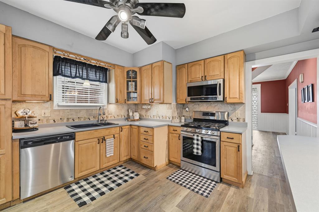 144 Davis Avenue McKees Rocks, PA 15136 - Photo 23 of 50 a kitchen with stainless steel appliances a stove sink microwave and cabinets
