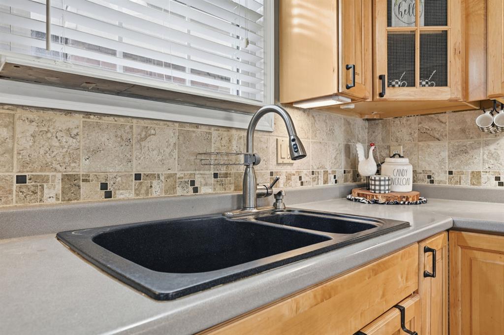 144 Davis Avenue McKees Rocks, PA 15136 - Photo 26 of 50 a kitchen with a sink a counter top and a stove
