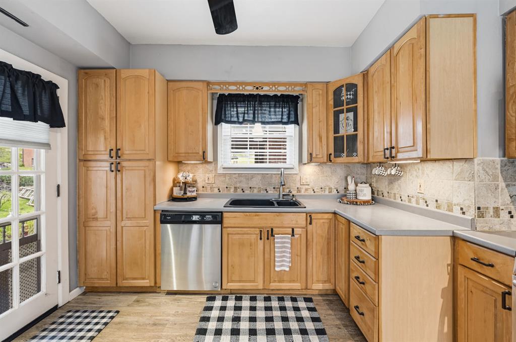144 Davis Avenue McKees Rocks, PA 15136 - Photo 27 of 50 a kitchen with granite countertop a sink stove and refrigerator