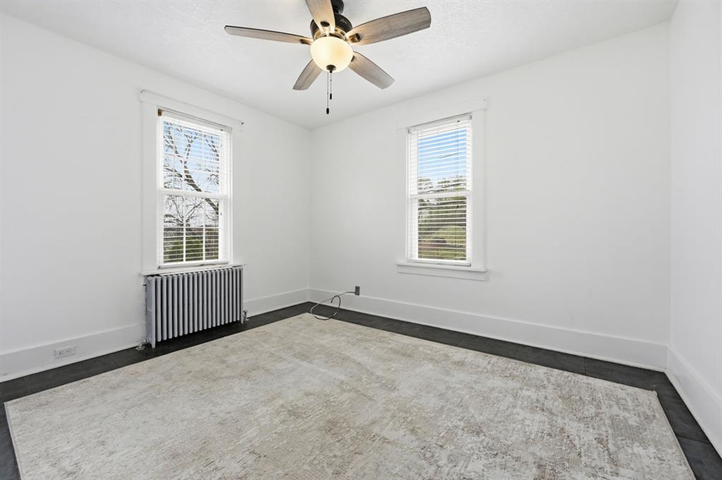 144 Davis Avenue McKees Rocks, PA 15136 - Photo 33 of 50 an empty room with windows and fan
