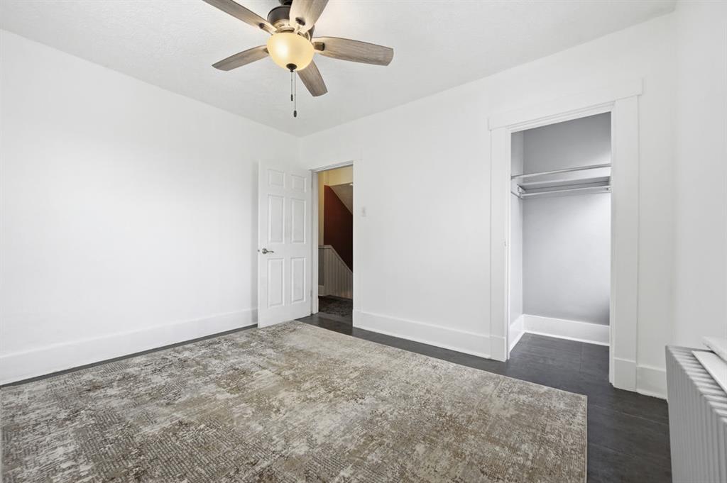 144 Davis Avenue McKees Rocks, PA 15136 - Photo 35 of 50 an empty room with closet and a chandelier fan