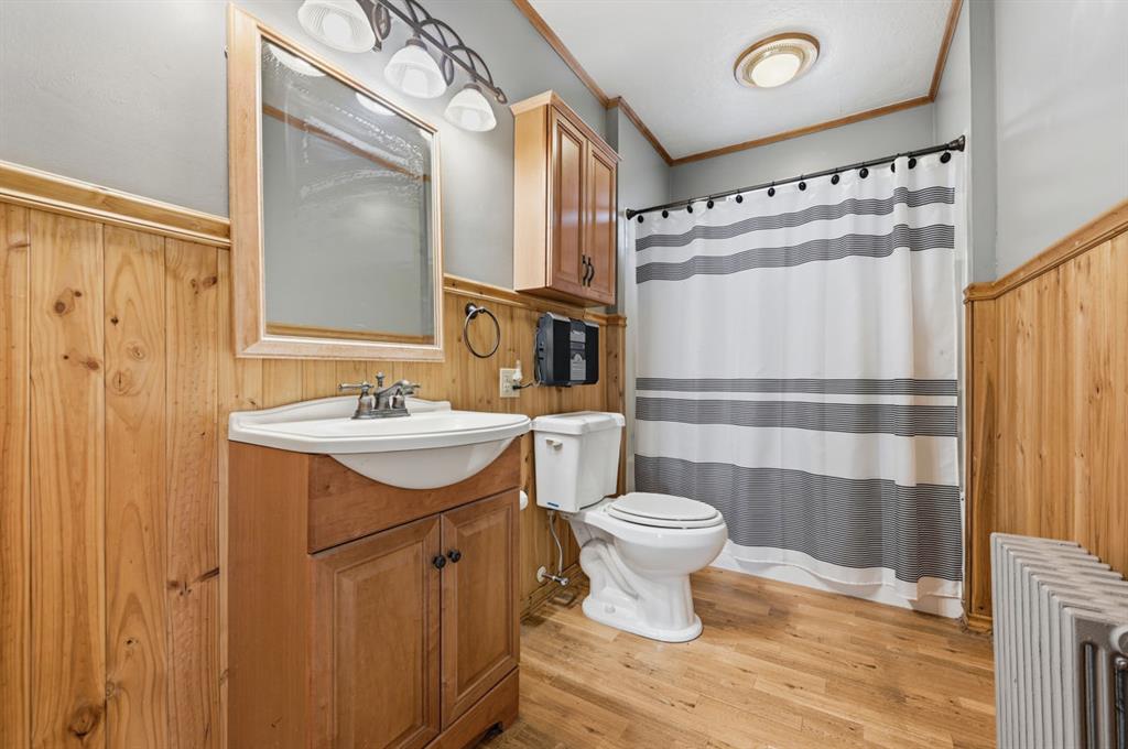 144 Davis Avenue McKees Rocks, PA 15136 - Photo 47 of 50 a bathroom with a sink toilet a mirror and shower