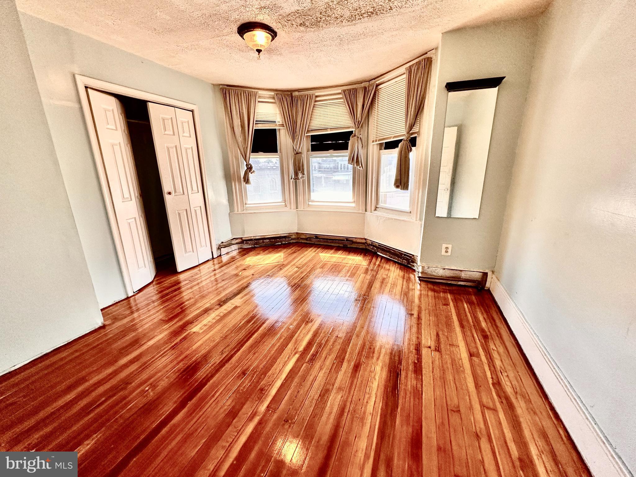 3223 North Bambrey Street Philadelphia, PA 19129 - Photo 14 of 14 a view of a room with wooden floor and staircase