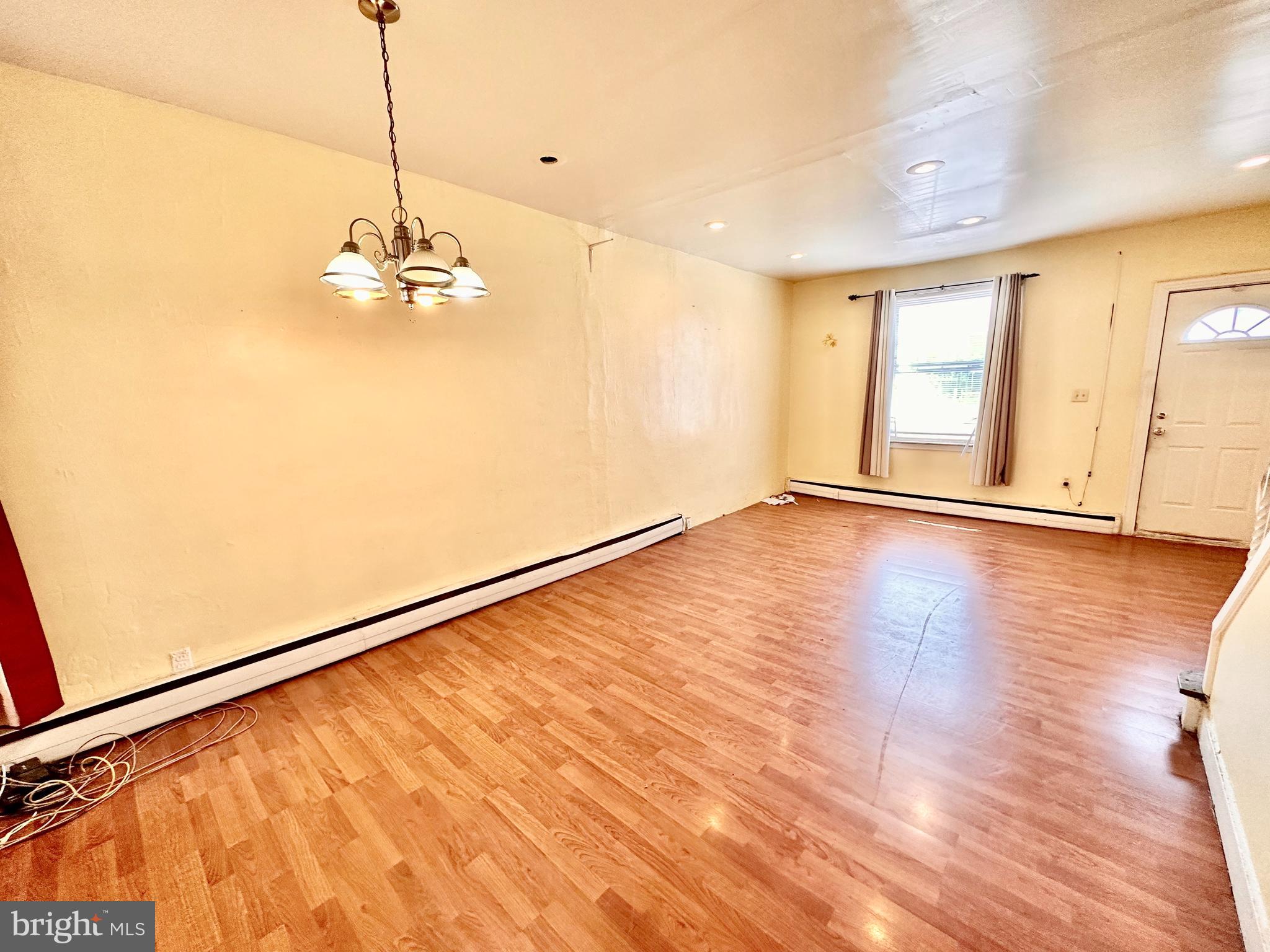 3223 North Bambrey Street Philadelphia, PA 19129 - Photo 5 of 14 a view of an empty room with a window and wooden floor