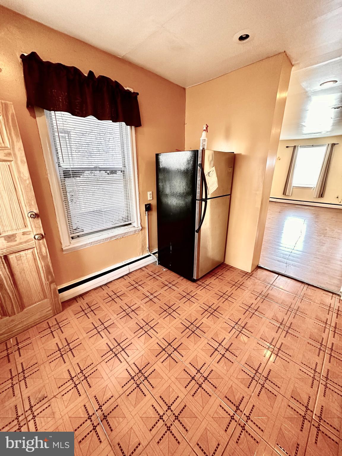 3223 North Bambrey Street Philadelphia, PA 19129 - Photo 8 of 14 a bedroom with a bed and wooden floor