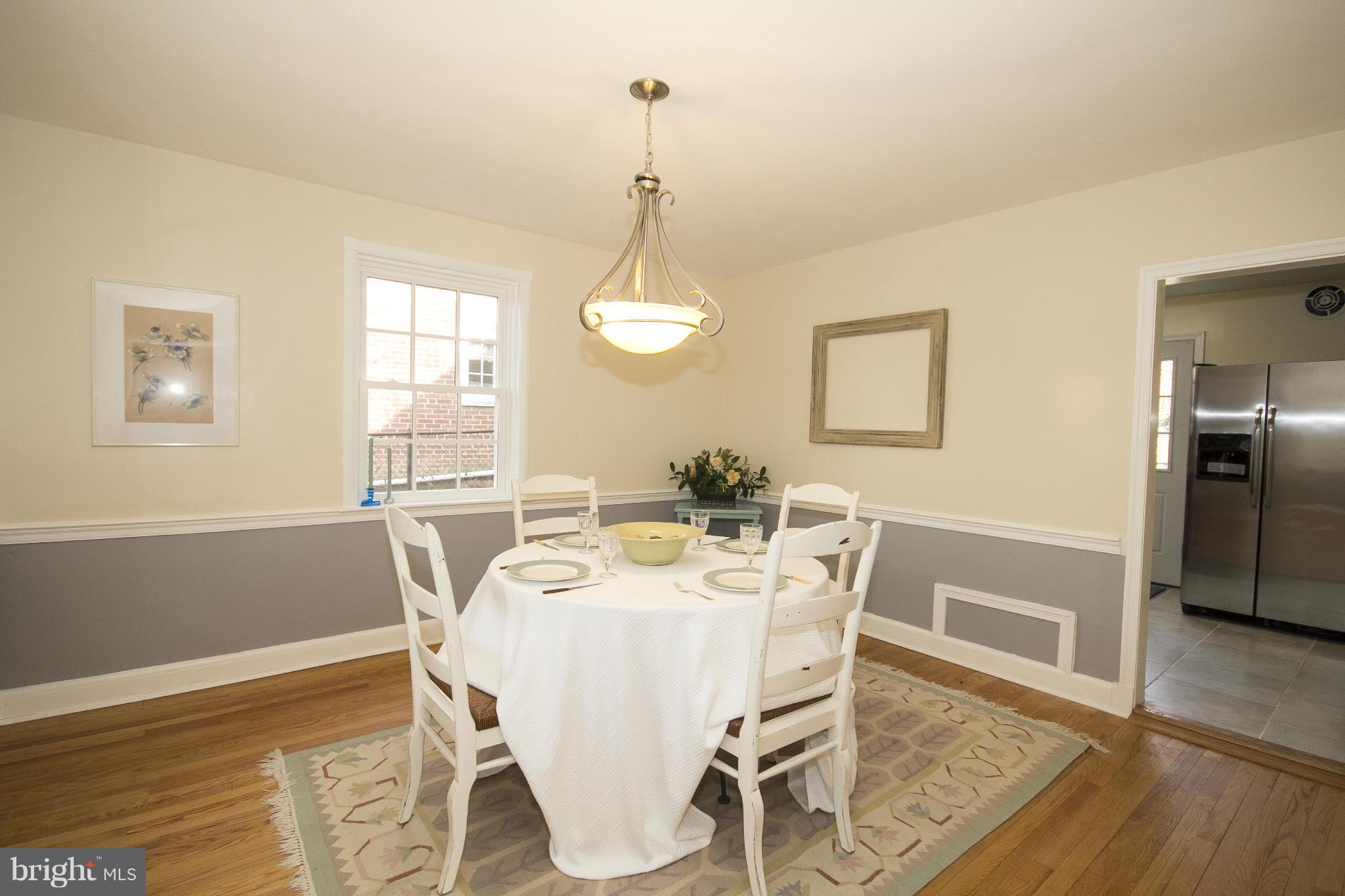 4033 Deepwood Road Baltimore, MD 21218 - Photo 8 of 30 a view of a dining room with furniture window and wooden floor