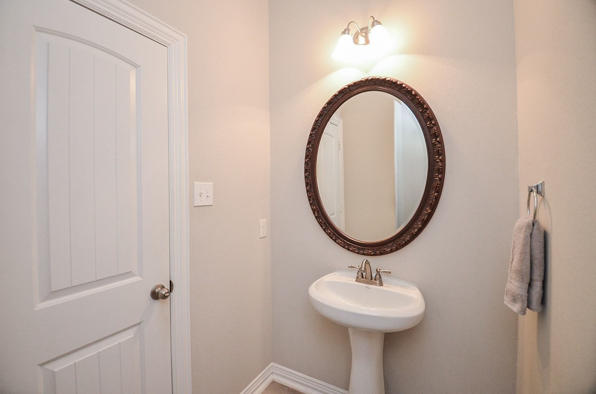 2714 Topaz Cove Lane Rosharon, TX 77583 - Photo 10 of 50 a bathroom with a sink and a mirror
