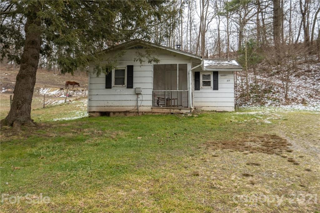 419 Incinerator Road Clyde, NC 28721 - Photo 1 of 17 a front view of a house with a yard
