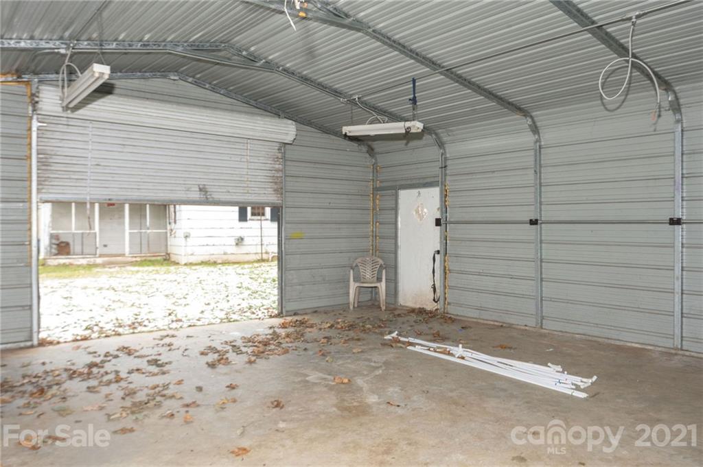 419 Incinerator Road Clyde, NC 28721 - Photo 12 of 17 a view of a backyard with wooden fence