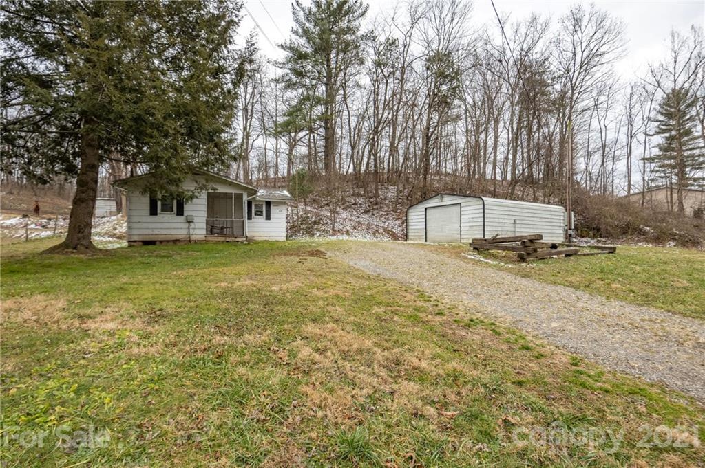 419 Incinerator Road Clyde, NC 28721 - Photo 14 of 17 a view of a house with a yard