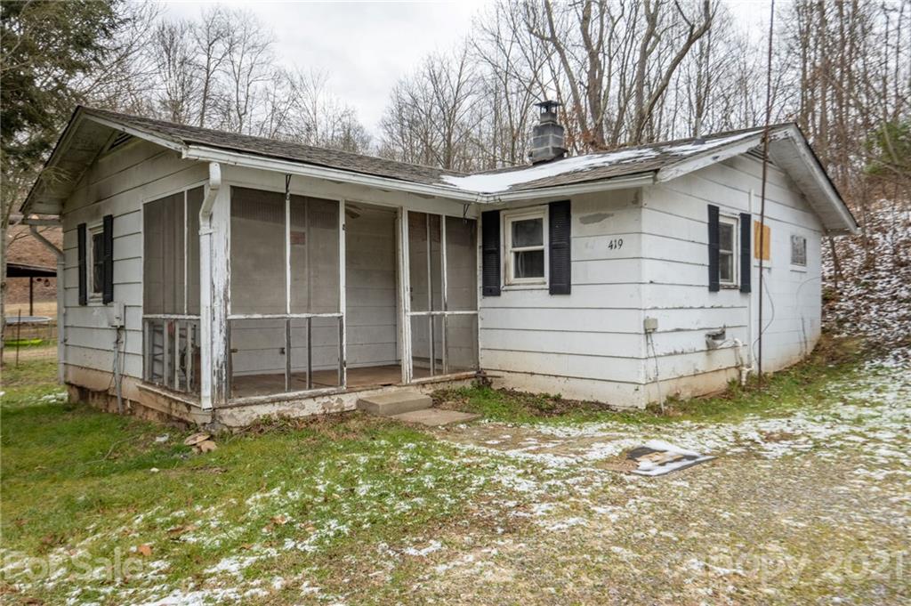419 Incinerator Road Clyde, NC 28721 - Photo 16 of 17 a view of a house with a yard