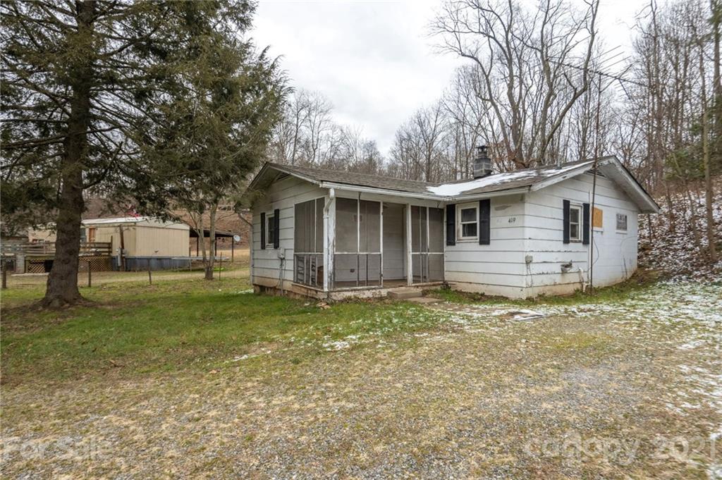 419 Incinerator Road Clyde, NC 28721 - Photo 17 of 17 a front view of a house with a garden