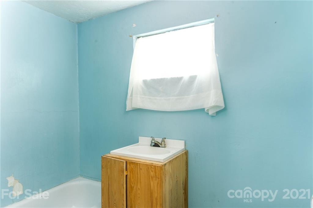 419 Incinerator Road Clyde, NC 28721 - Photo 5 of 17 a utility room with a window dryer and washer