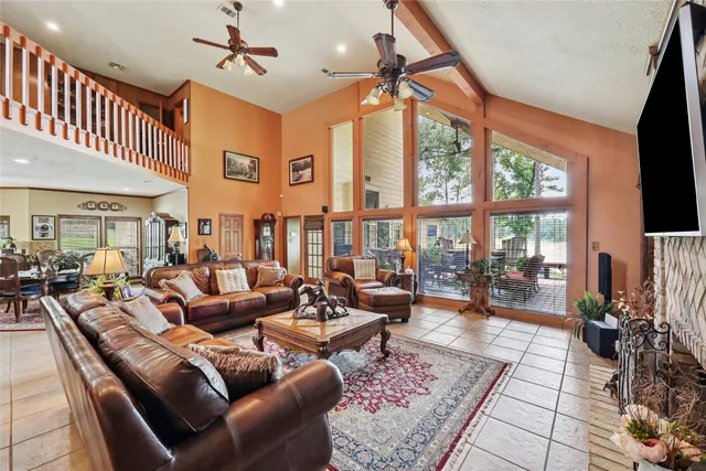 a living room with furniture fireplace and a flat screen tv