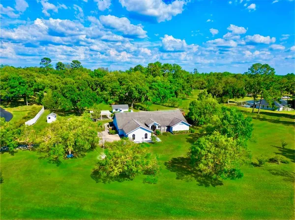 a backyard of a house with lots of green space