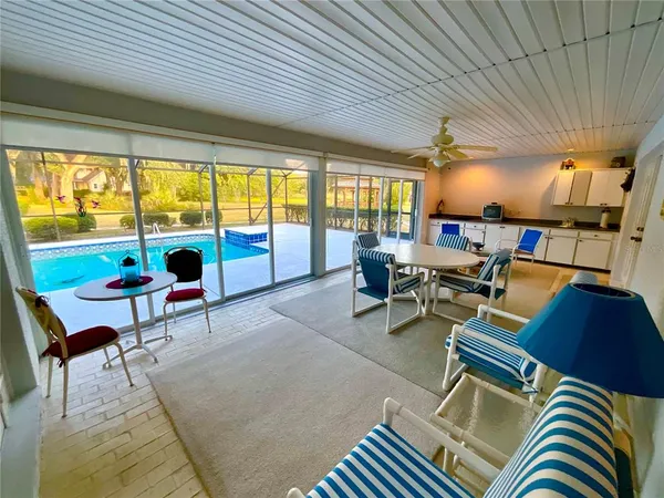 a view of a swimming pool with a patio