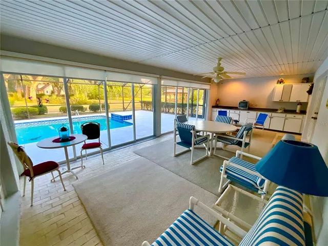 a view of a swimming pool with a patio