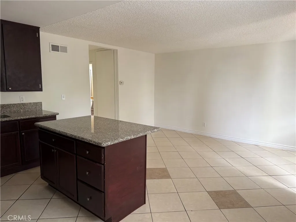 3791 Harvill Lane, Unit 4 Riverside, CA 92503 - Photo 4 of 10 a kitchen with a sink and cabinets