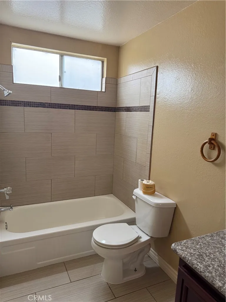 3791 Harvill Lane, Unit 4 Riverside, CA 92503 - Photo 6 of 10 a bathroom with a toilet a sink and bathtub