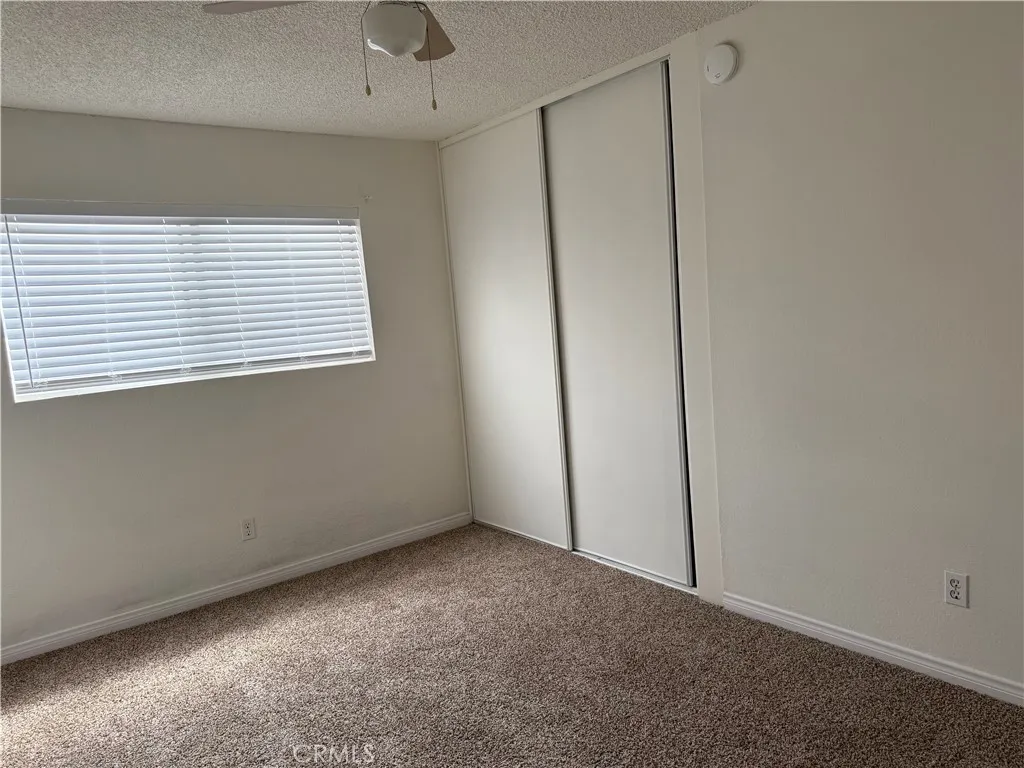 3791 Harvill Lane, Unit 4 Riverside, CA 92503 - Photo 7 of 10 a view of an empty room with a window