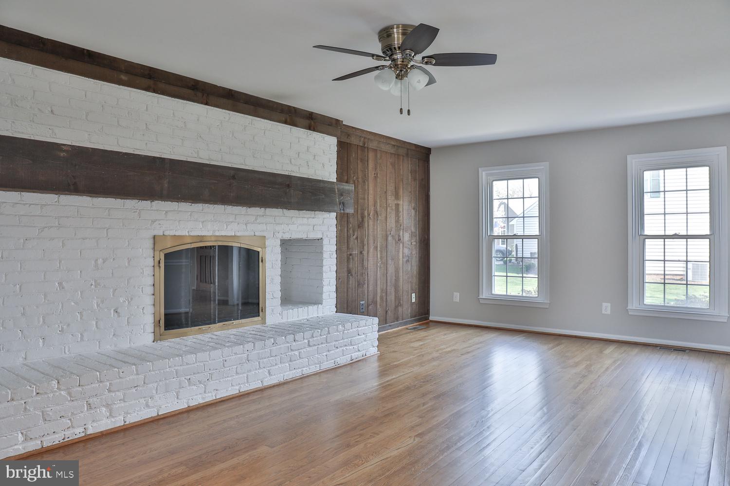 5423 Rilian Court Burke, VA 22015 - Photo 35 of 67 a view of an empty room with a fireplace and a window