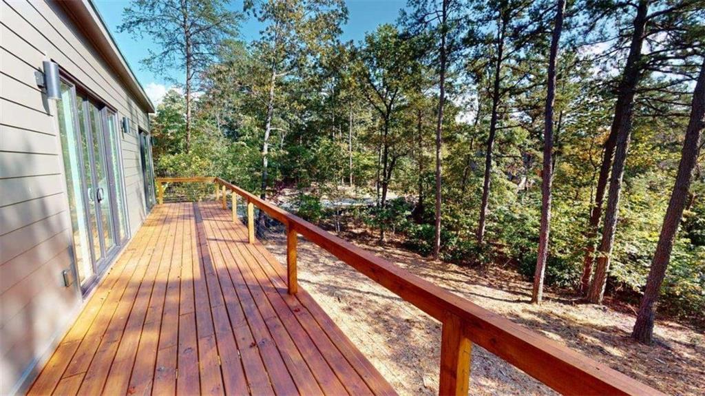 525 Brannon Ridge Young Harris, GA 30582 - Photo 6 of 12 a view of balcony with wooden floor and fence