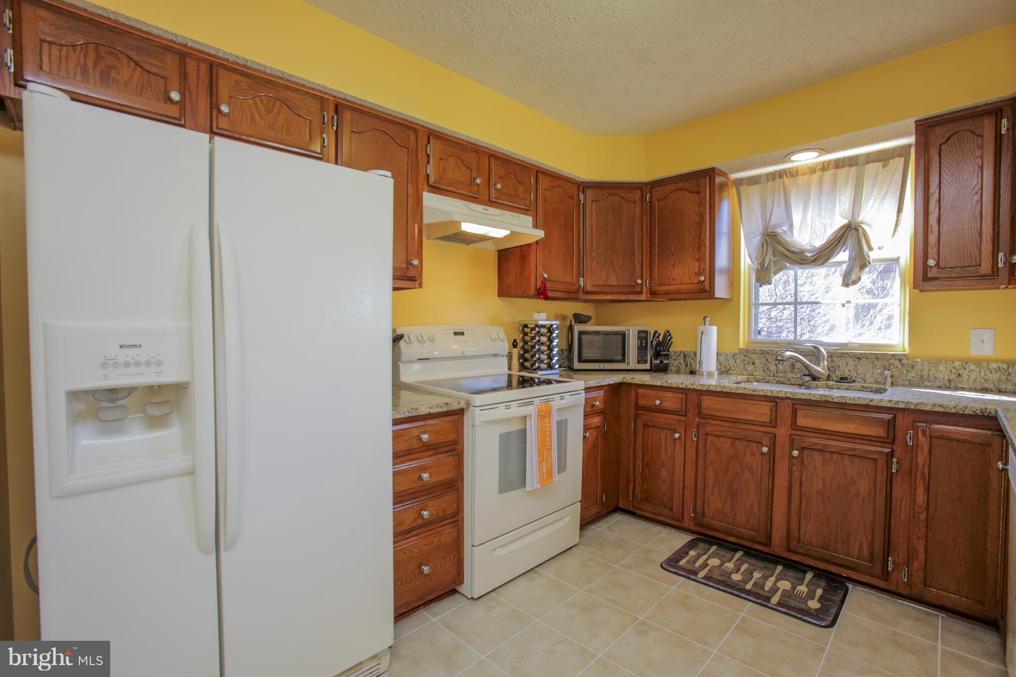 14073 Winding Ridge Lane Centreville, VA 20121 - Photo 10 of 29 Kitchen - new stove, ceramic tiles, Granite