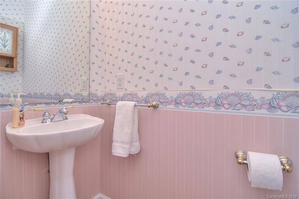 11159 Scullers Run Tega Cay, SC 29708 - Photo 14 of 28 a bathroom with a sink and a mirror