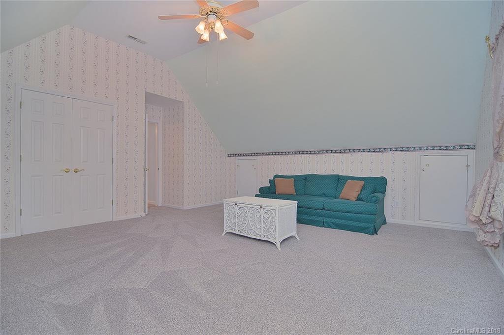 11159 Scullers Run Tega Cay, SC 29708 - Photo 22 of 28 an entryway with bed and a chandelier fan