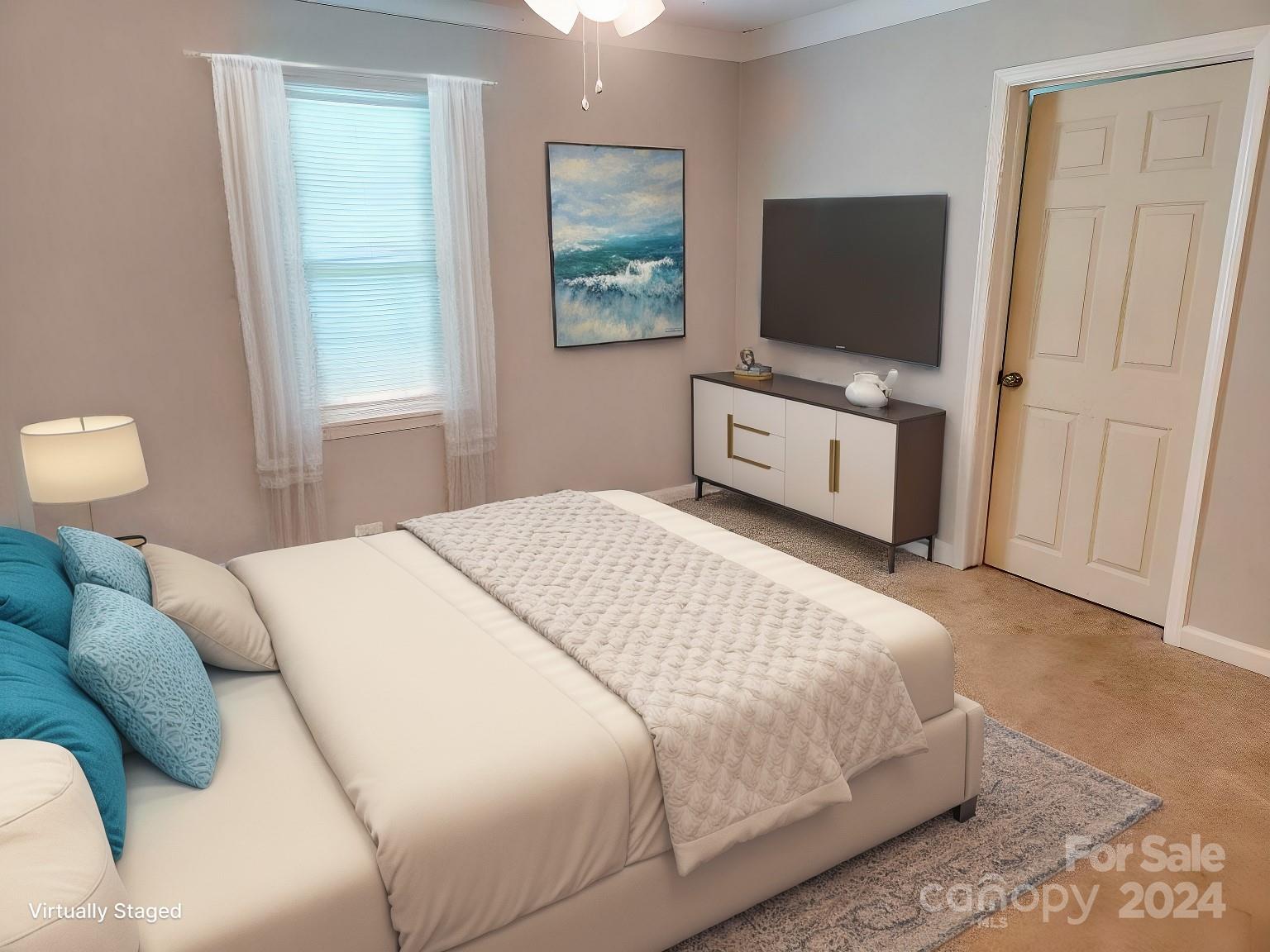 163 Hambright Road Clover, SC 29710 - Photo 7 of 12 a bedroom with a bed and a flat screen tv