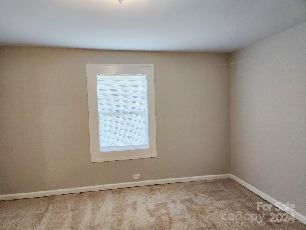 163 Hambright Road Clover, SC 29710 - Photo 8 of 12 an empty room with a window