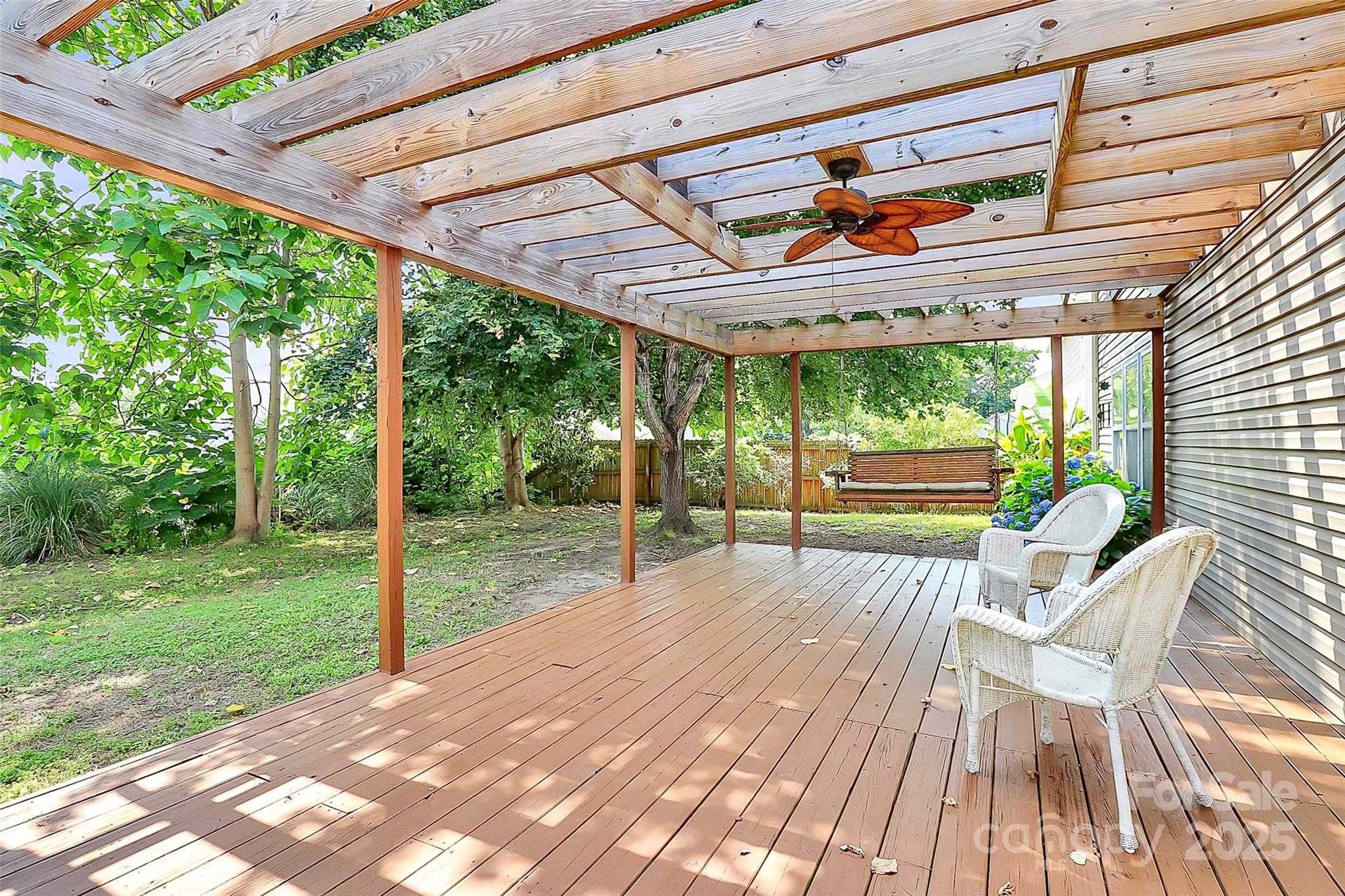 1817 Tradd Avenue Clover, SC 29710 - Photo 12 of 42 a porch with a table and chairs in front of it