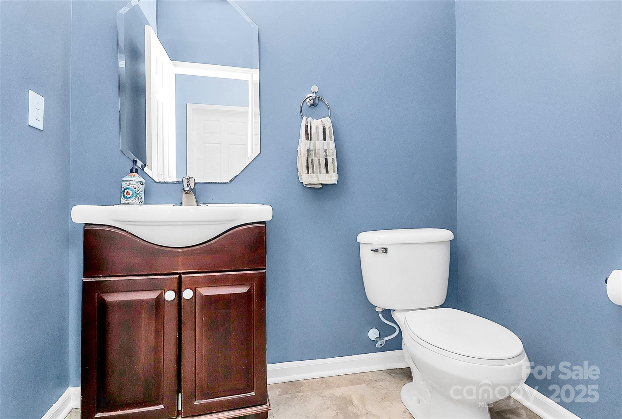 1817 Tradd Avenue Clover, SC 29710 - Photo 28 of 42 a bathroom with a toilet a sink and mirror