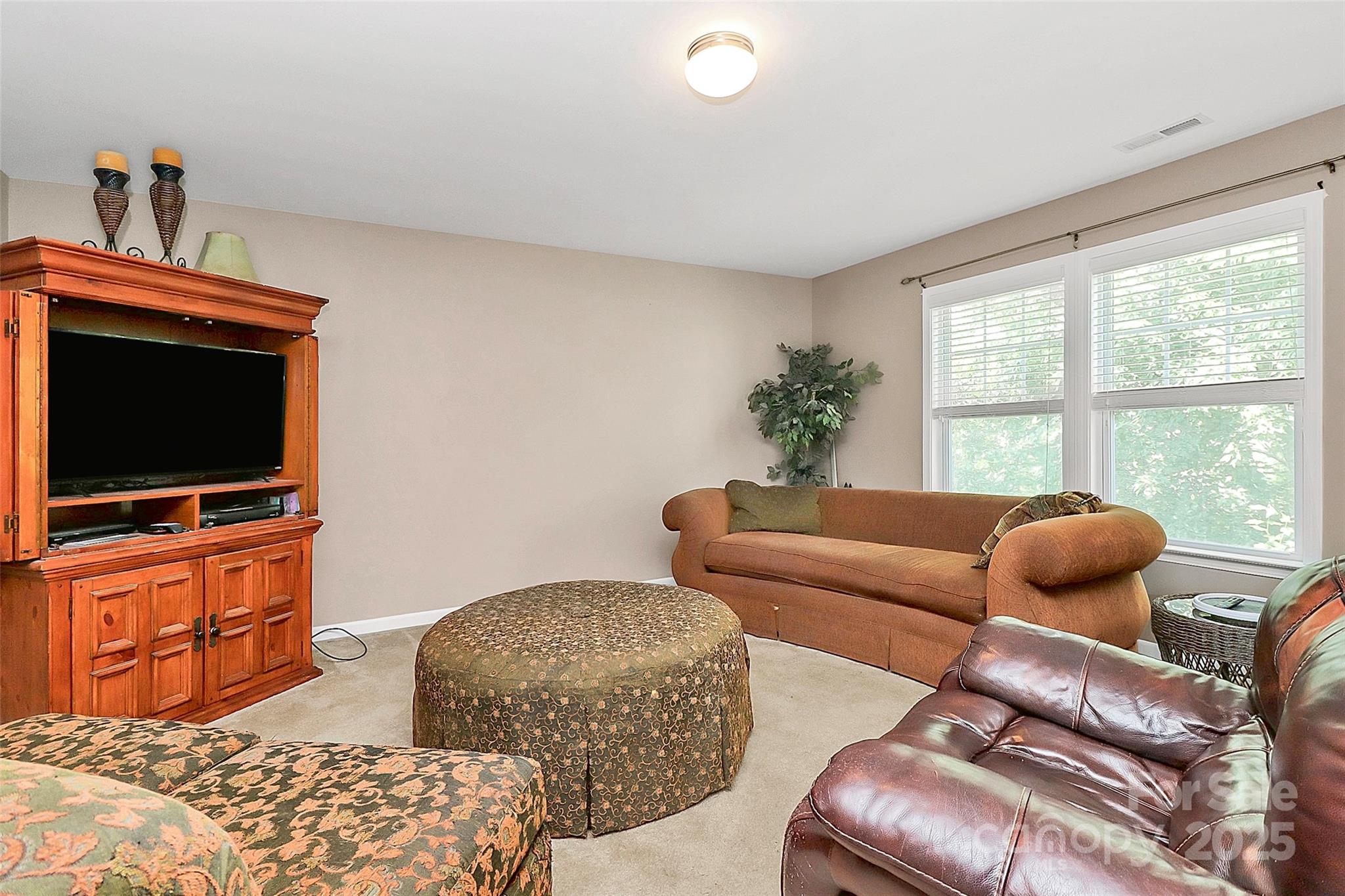 1817 Tradd Avenue Clover, SC 29710 - Photo 30 of 42 a living room with furniture and a flat screen tv