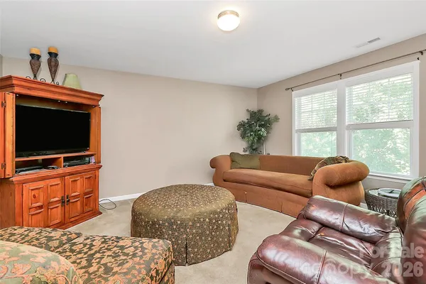 a room with a bed and a window