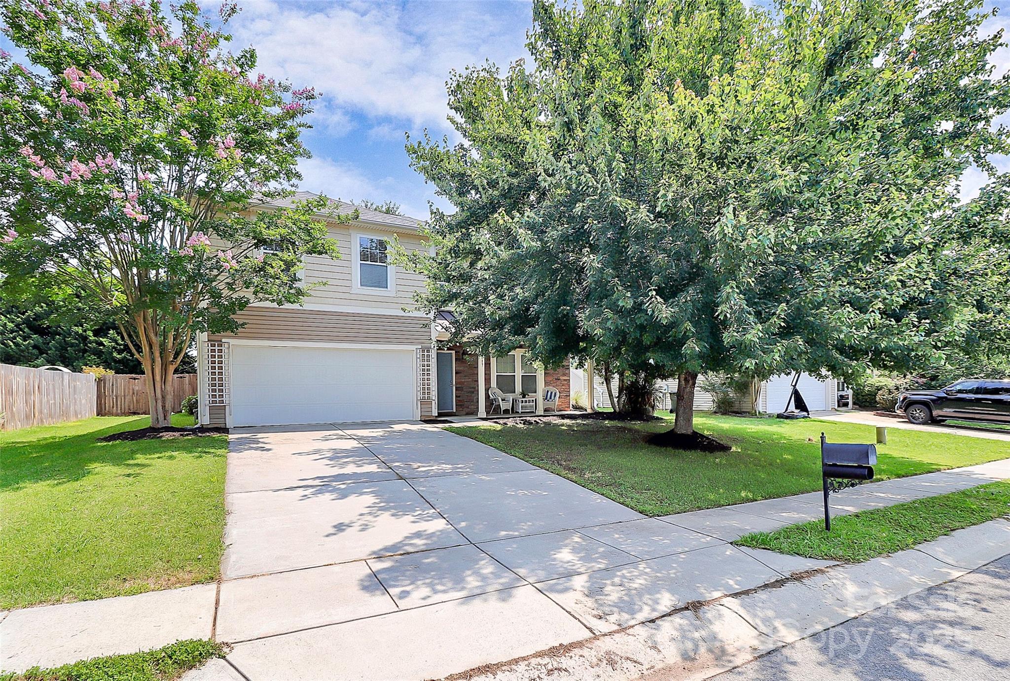 1817 Tradd Avenue Clover, SC 29710 - Photo 3 of 42 a front view of a house with a yard and trees