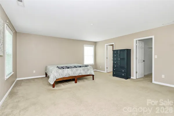 a bedroom with a bed and closet