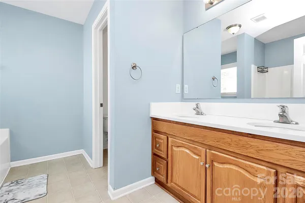 a white bath tub sitting next to a window