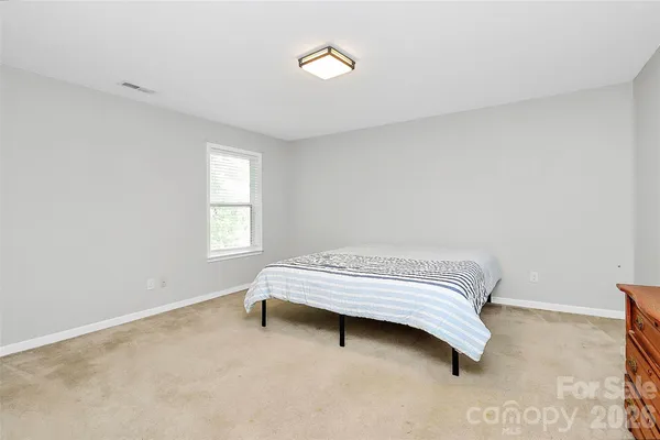 a bedroom with a bed and a closet