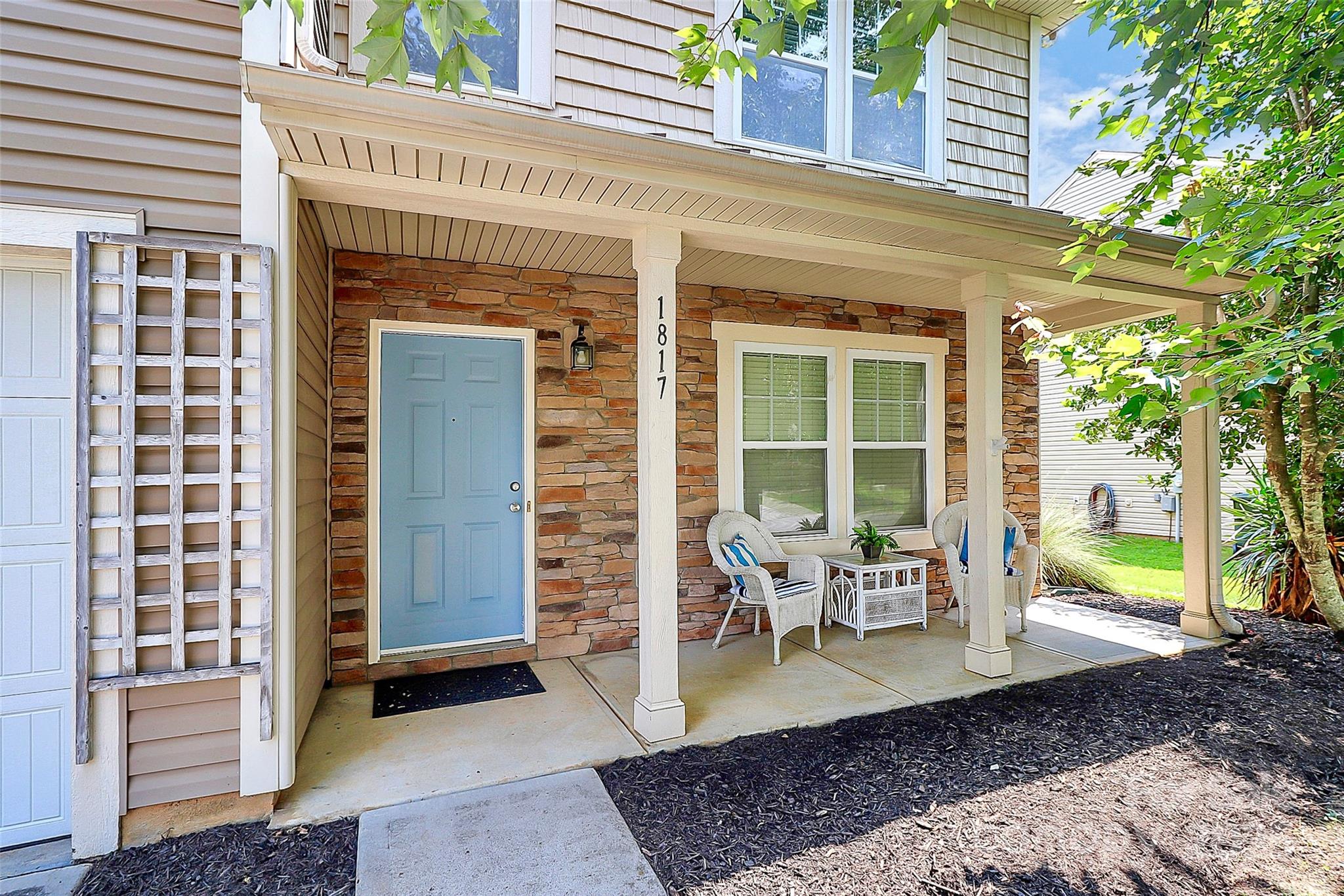 1817 Tradd Avenue Clover, SC 29710 - Photo 4 of 42 a view of a patio with table and chairs and potted plants