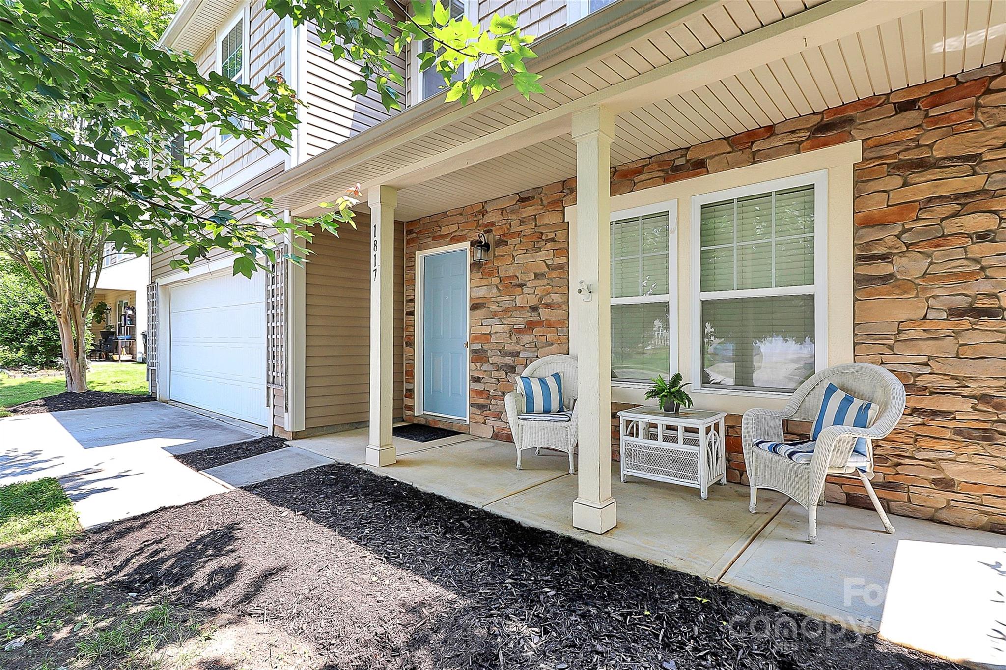 1817 Tradd Avenue Clover, SC 29710 - Photo 5 of 42 a view of a patio with table and chairs and potted plants