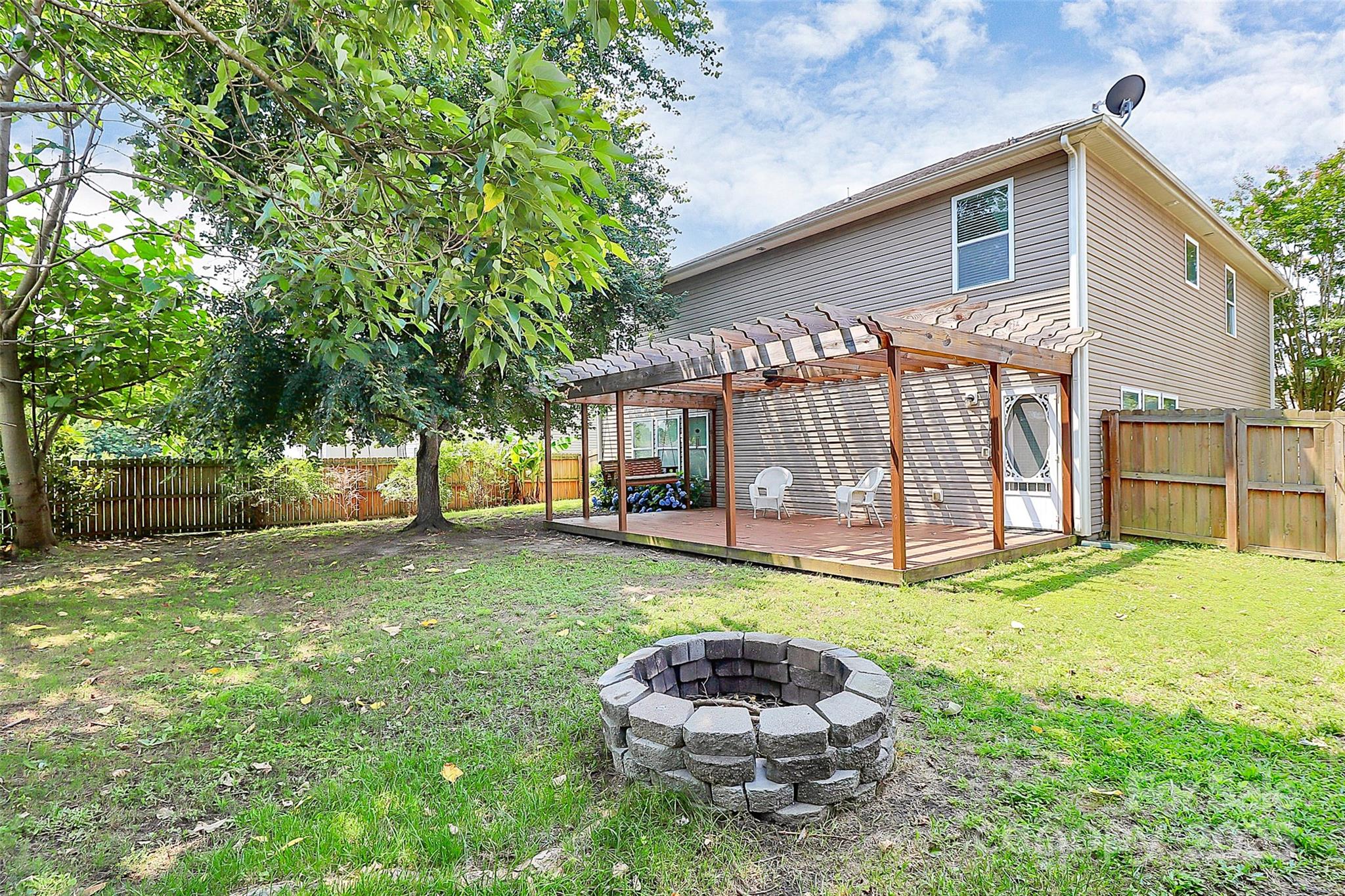 1817 Tradd Avenue Clover, SC 29710 - Photo 7 of 42 a large house with a big yard and large trees