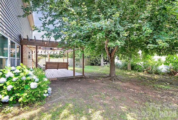 a backyard of a house with lots of green space