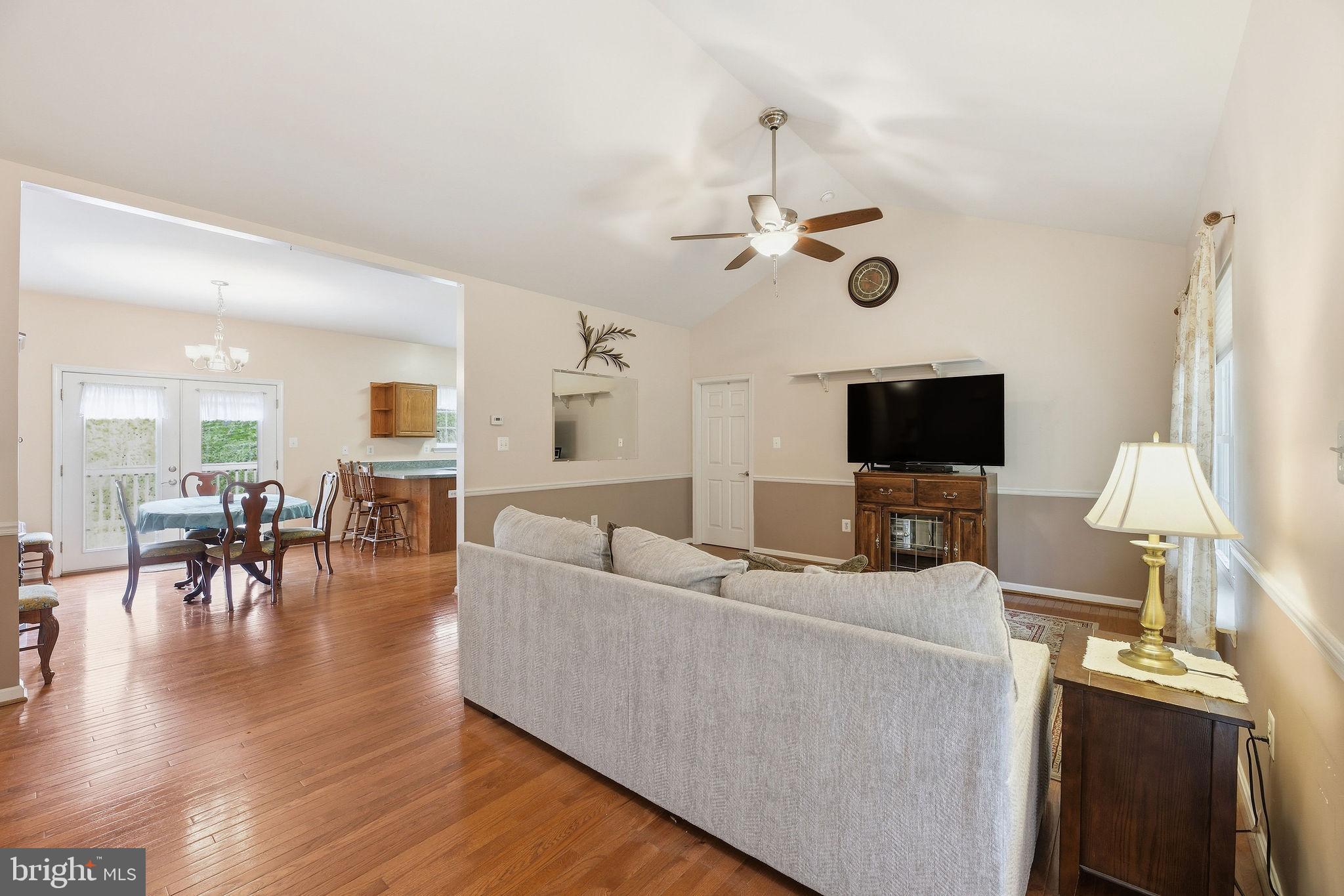 405 Ball Road St. Leonard, MD 20685 - Photo 11 of 40 a living room with furniture and a flat screen tv