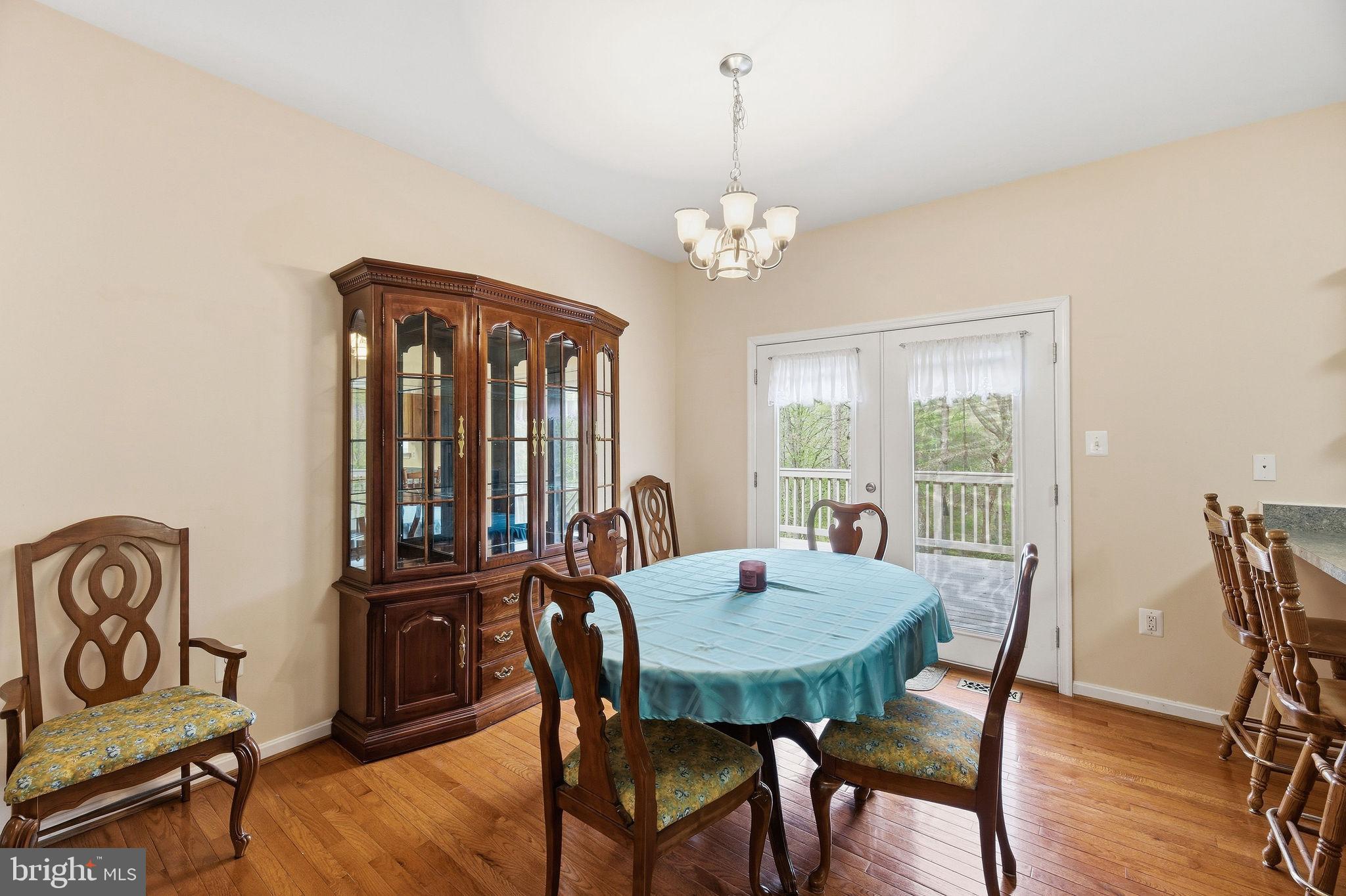 405 Ball Road St. Leonard, MD 20685 - Photo 13 of 40 a view of a dining room with furniture window and outside view