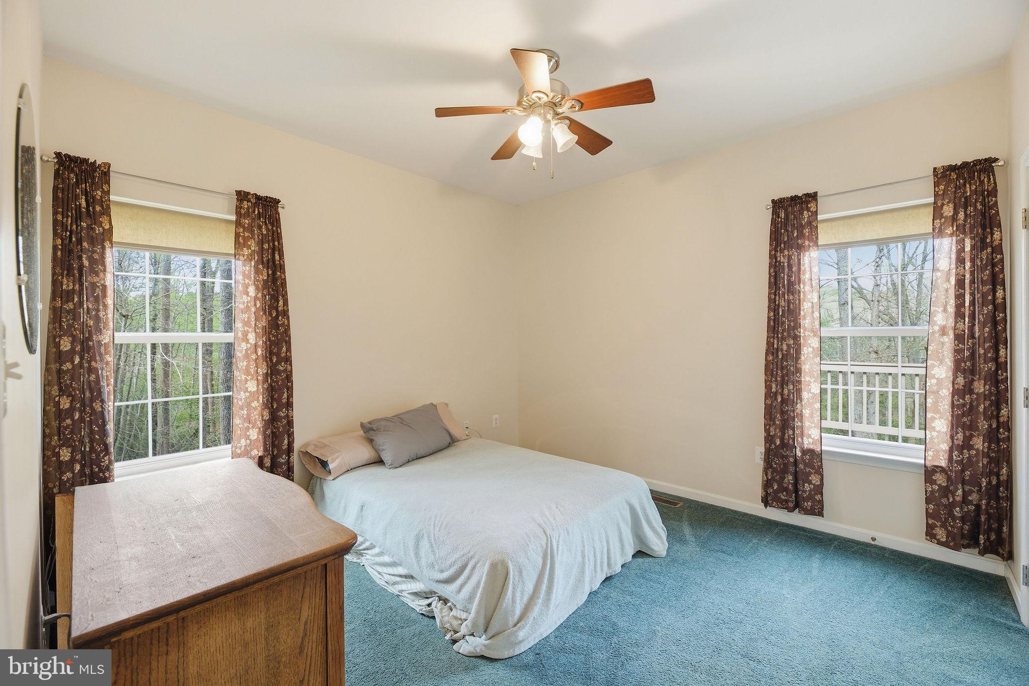 405 Ball Road St. Leonard, MD 20685 - Photo 23 of 40 a bedroom with a bed dresser and a window