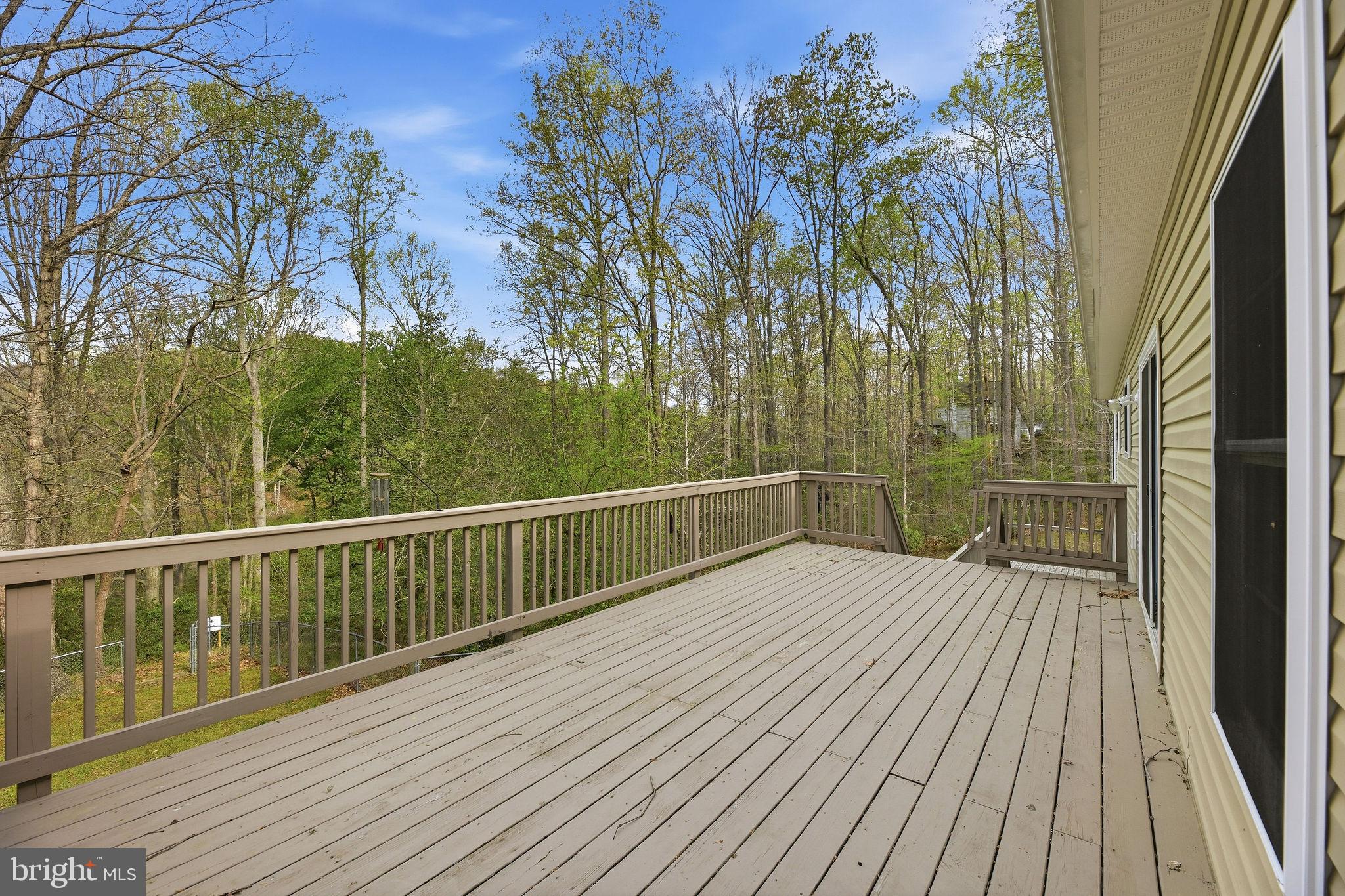 405 Ball Road St. Leonard, MD 20685 - Photo 24 of 40 a view of balcony with wooden floor and fence