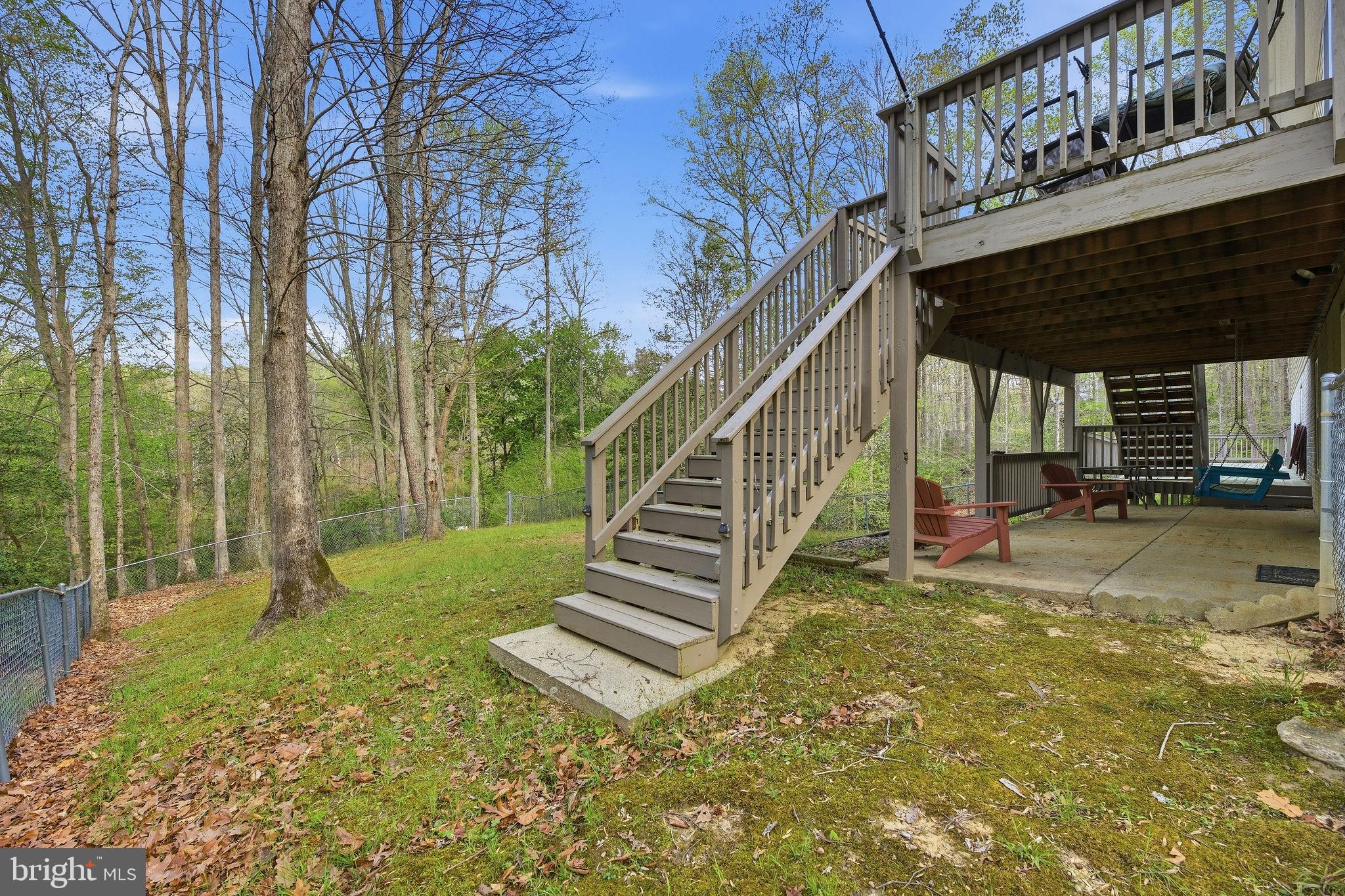 405 Ball Road St. Leonard, MD 20685 - Photo 26 of 40 a view of a backyard with a deck