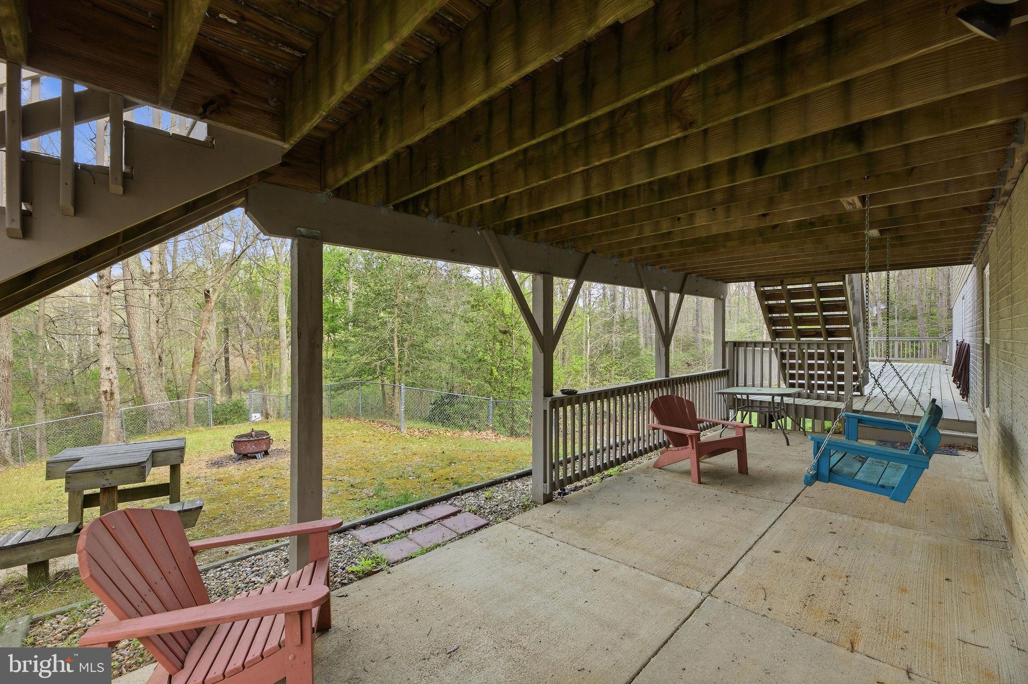 405 Ball Road St. Leonard, MD 20685 - Photo 27 of 40 a balcony with chairs and city view